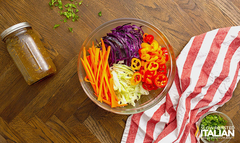 sliced veggies in glass bowl