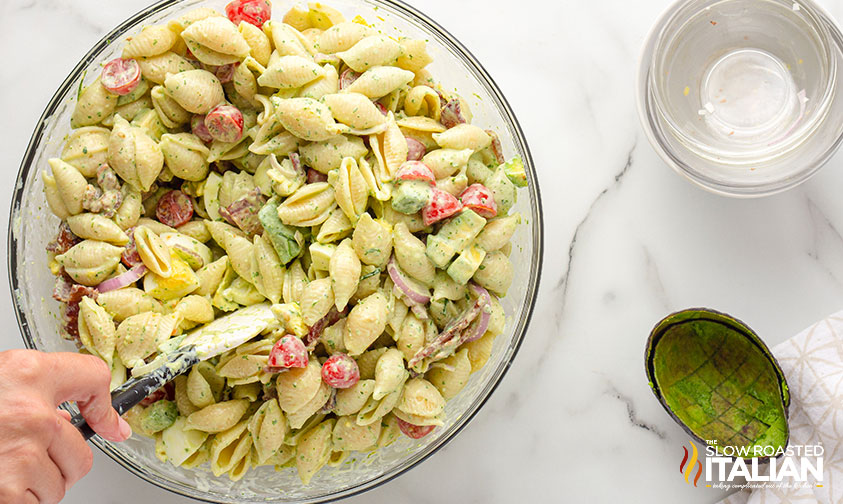 mixing bowl of pasta salad with spatula