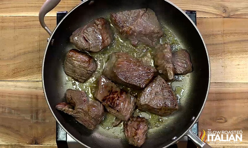 searing pieces of chuck roast in skillet