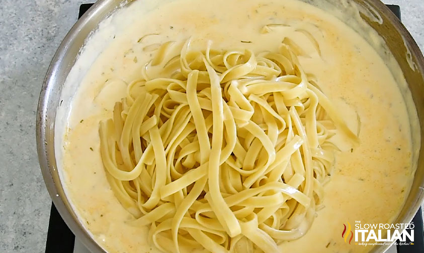 cooked fettucine in creamy sauce