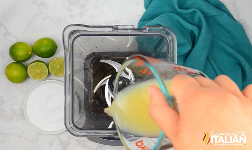 pouring lime juice into blender