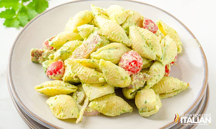 green goddess pasta salad on a stack of plates