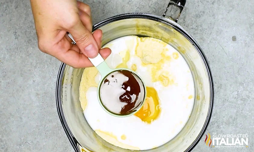 adding honey to corn dog batter