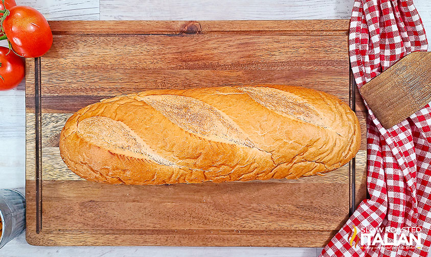 loaf of French bread on cutting board