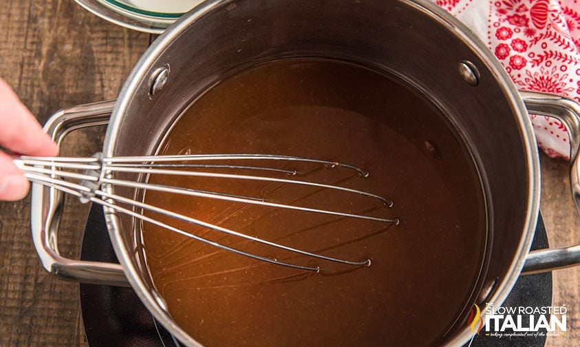 whisking sweet and sour sauce 