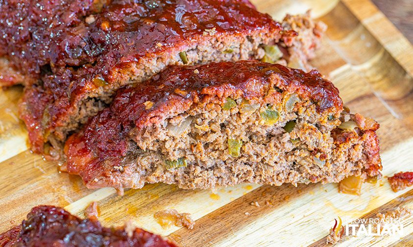 sliced smoked meatloaf on cutting board