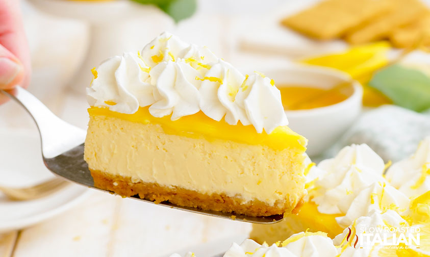 serving slice of lemon curd cheesecake