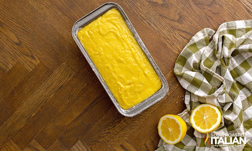 lemon pound cake batter smoothed into loaf pan