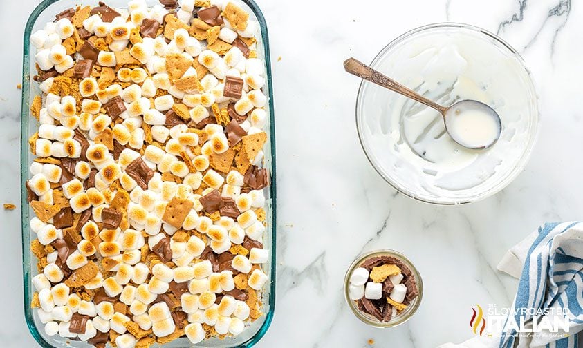 poke cake topped with smores ingredients