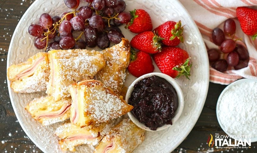 overhead: plate with monte cristo sandwiches, jam, and fresh fruit