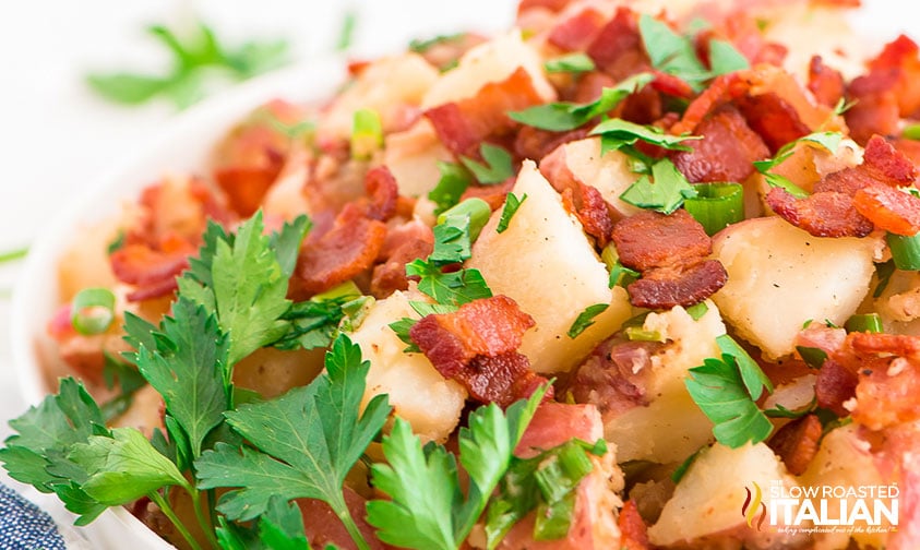 close up: warm potato salad topped with parsley