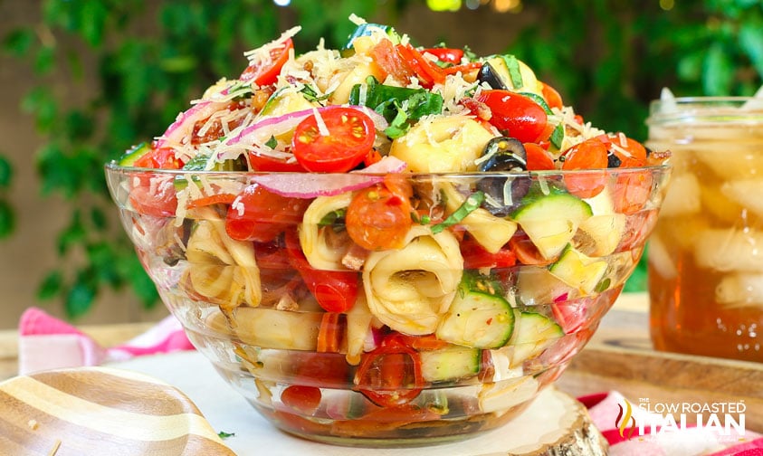 big clear bowl of pasta salad with pepperoni