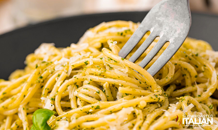 twirling pesto pasta with a fork