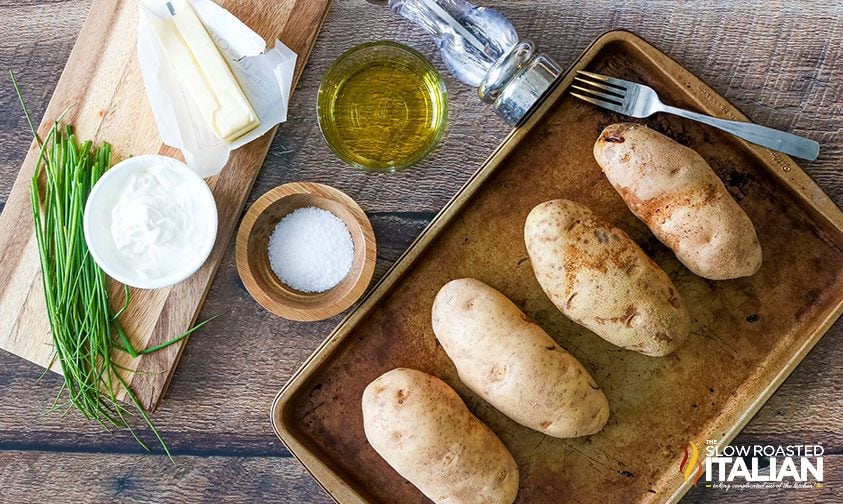 tray of russet potatoes with oil, salt, and toppings