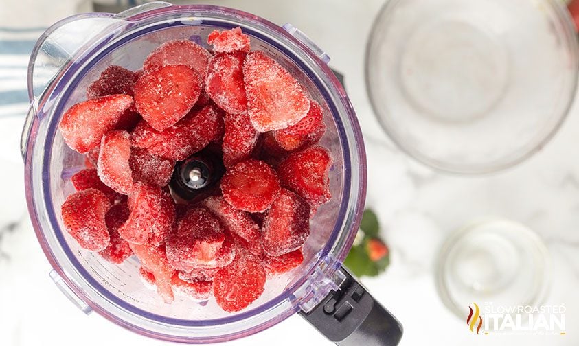 overhead: strawberry daiquiri ingredients in blender