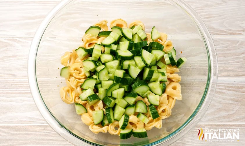 chopped cucumbers in bowl with tortellini