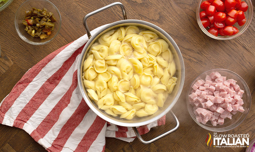 cooked tortellini in colander 