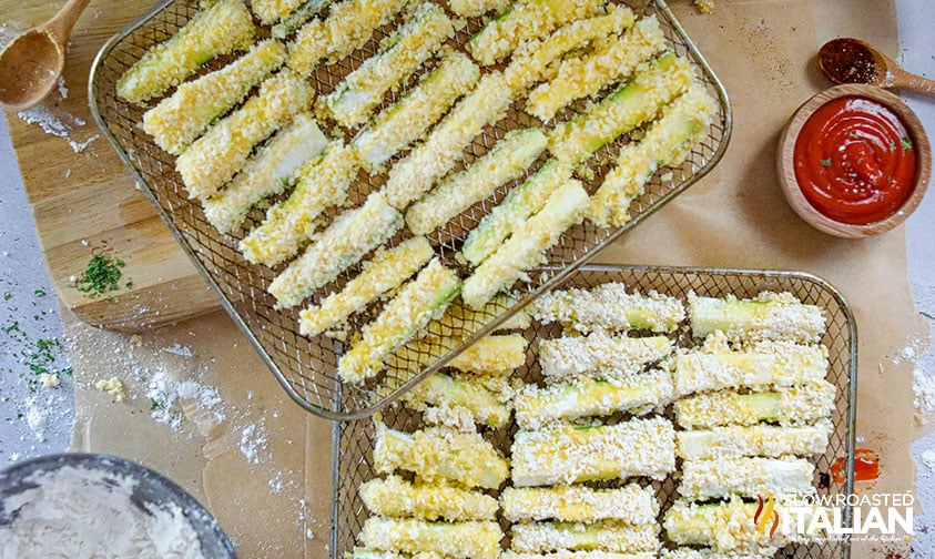 panko coated zucchini spears in wire baskets