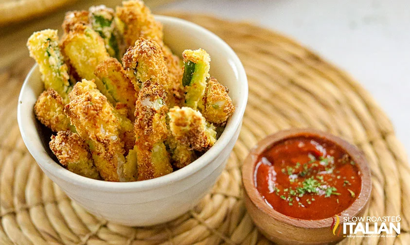 air fried zucchini fries in bowl with dipping sauce