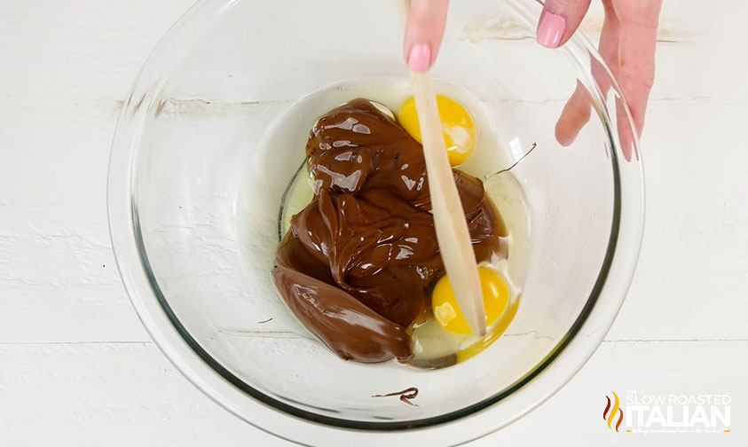 mixing Nutella and eggs in bowl