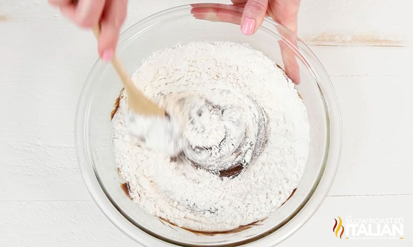 mixing flour into brownie batter