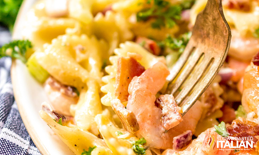 close up of bacon shrimp pasta salad with fork
