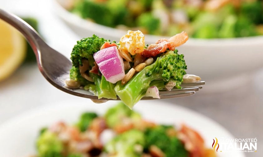 close up of broccoli salad on fork