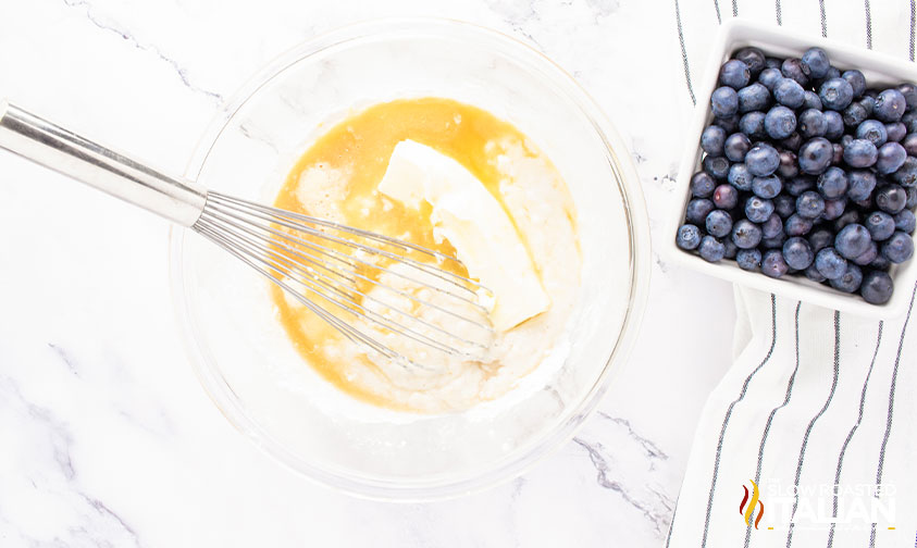 whisking ingredients in a mixing bowl