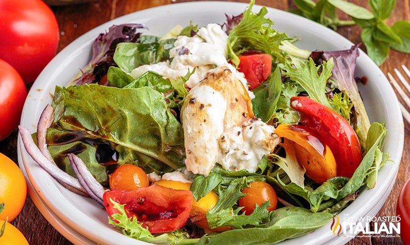 burrata salad in a white bowl