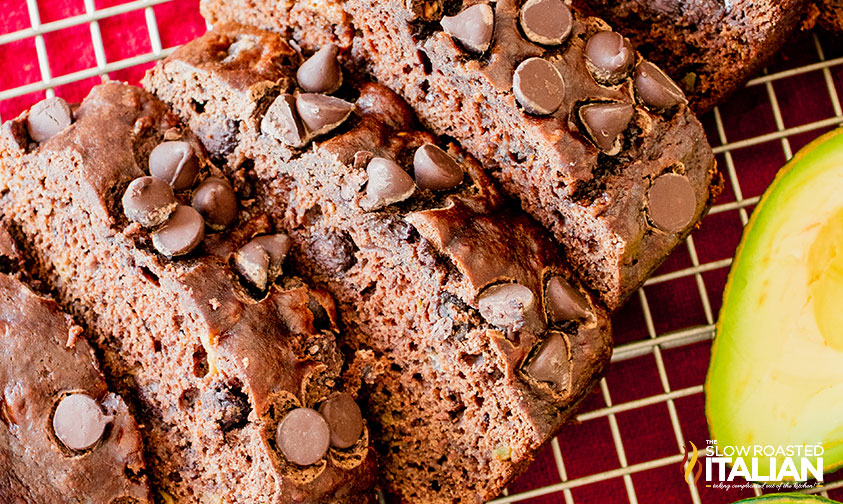 sliced chocolate avocado banana bread on a cooling rack