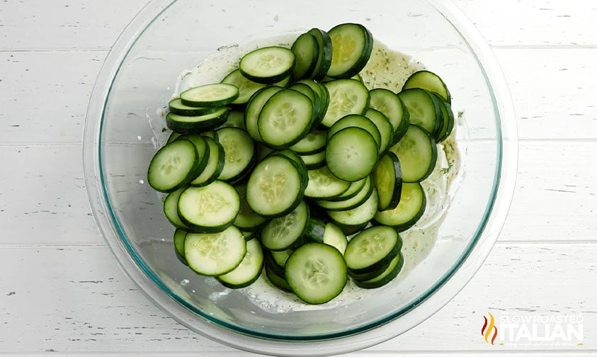 sliced cucumbers in a glass bowl