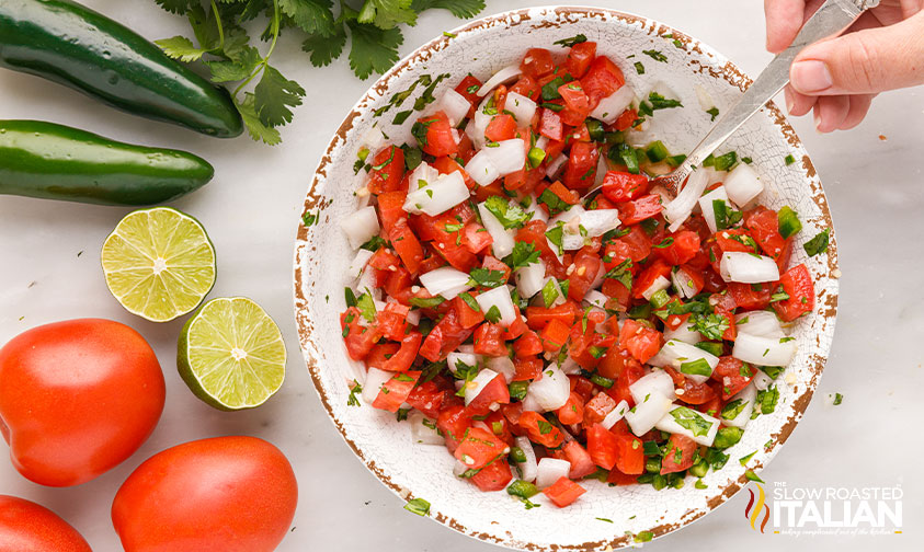 mixed onion, tomato, cilantro garlic and jalapenos in dish