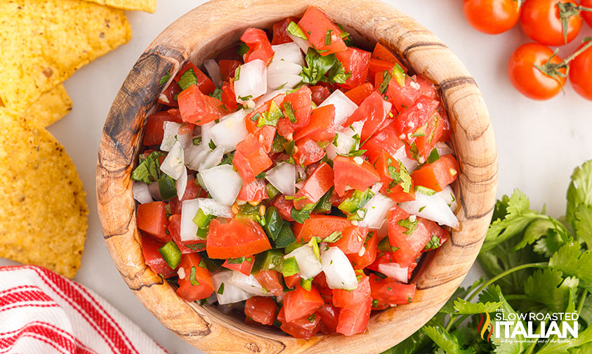 pico de gallo in a wooden serving bowl