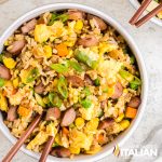 bowl of hot dog fried rice with chopsticks