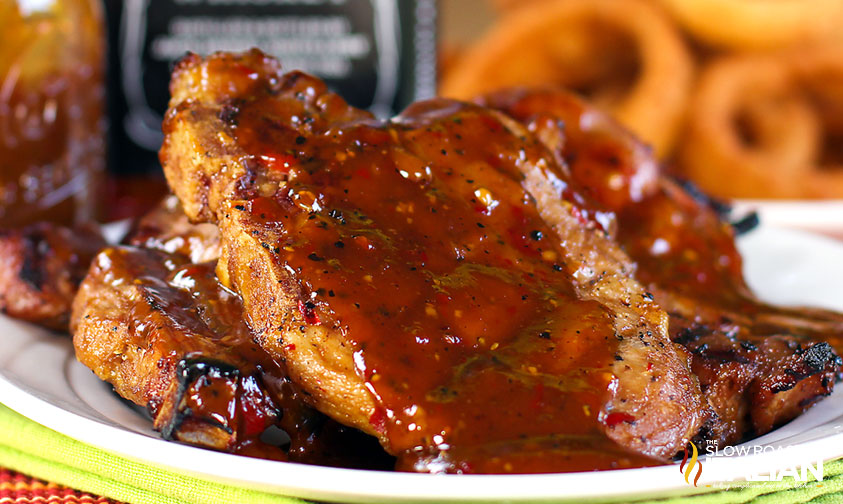 jack daniel's pork chops on a white plate