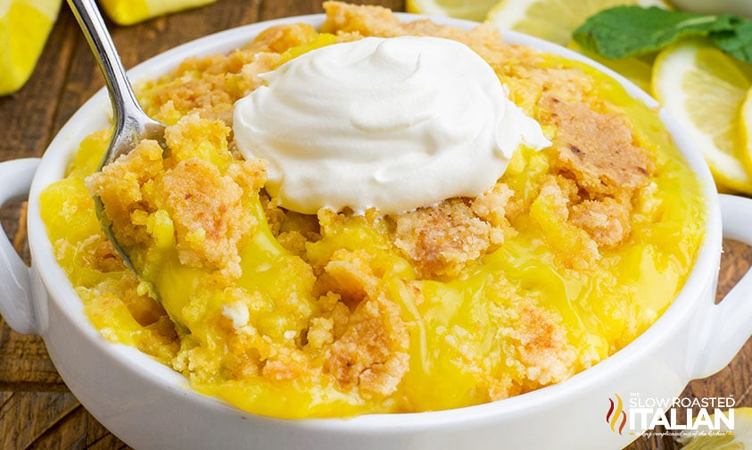 lemon dump cake in a white bowl