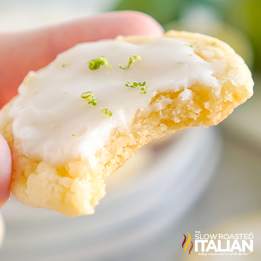 lime cookie with icing with a bite taken