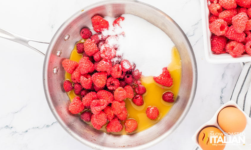 raspberries, fruit nectar and sugar in a saucepan