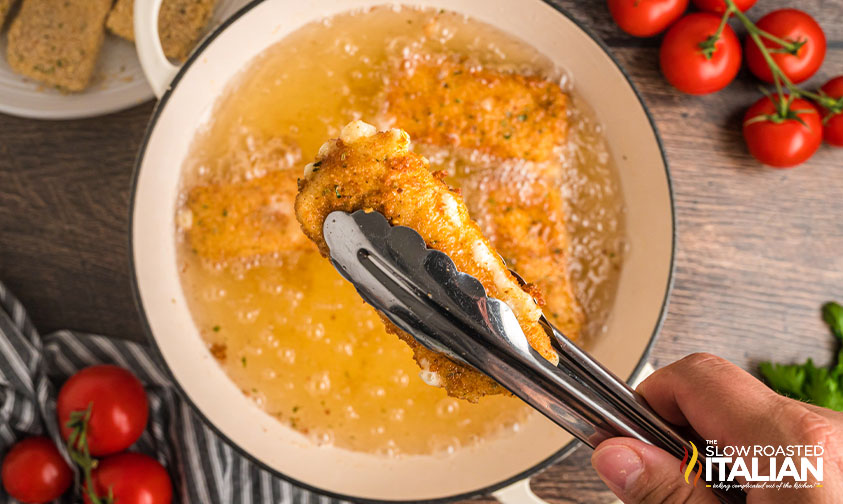 fried mozzarella in tongs