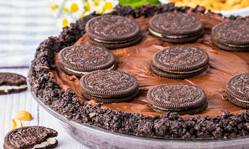 oreos placed on top of chocolate peanut butter pie