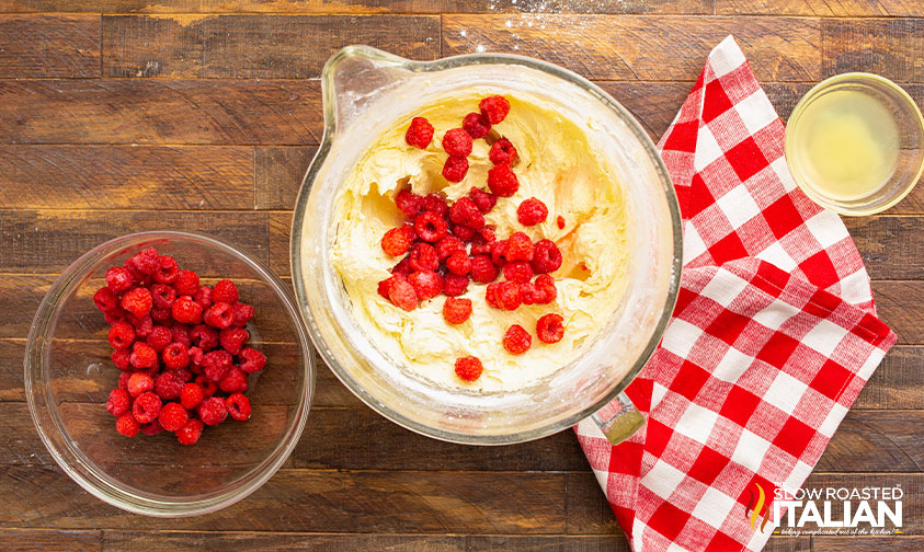 adding raspberries to bundt cake