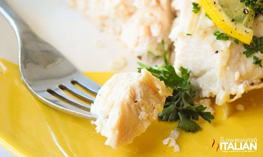 piece of lemon chicken on a fork