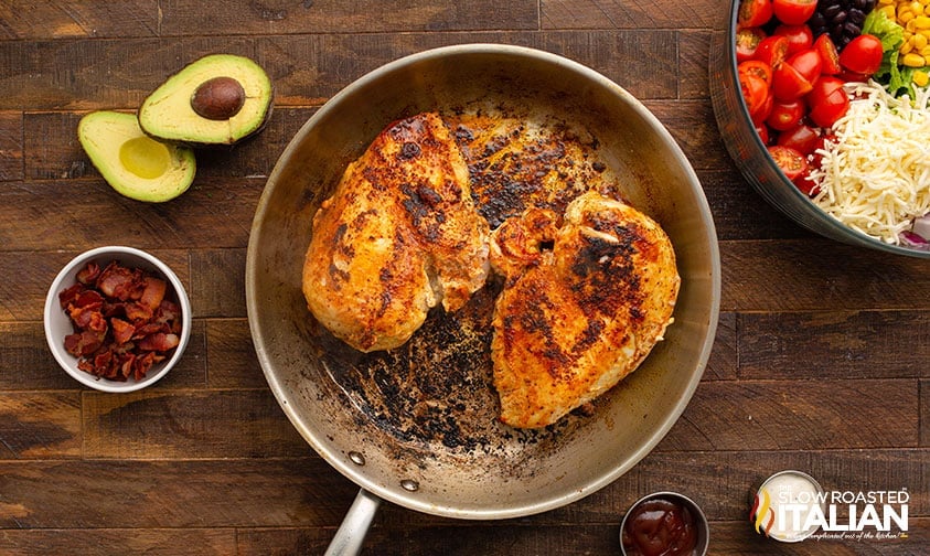 cooked chicken breasts in skillet