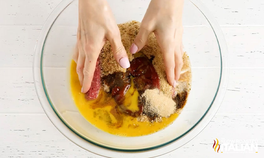 mixing meatloaf ingredients by hand