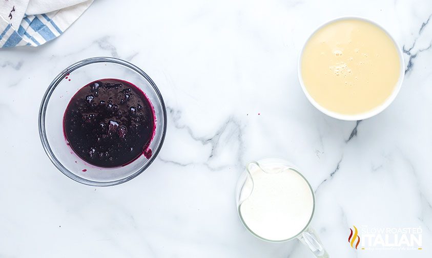 bowls of heavy cream, sweetened condensed milk, and blueberry base