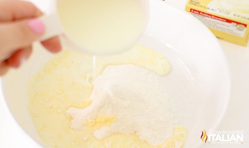mixing milk into cheesecake pudding mix