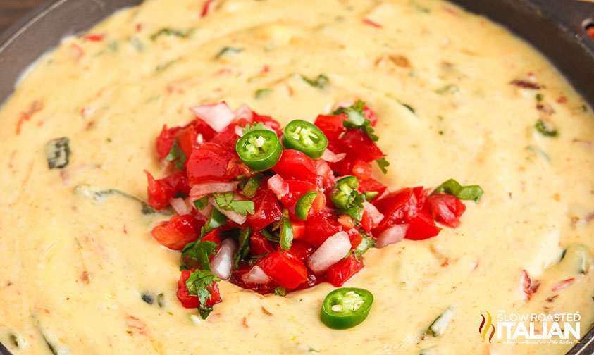 close up: queso blanco dip with pico de gallo in the center