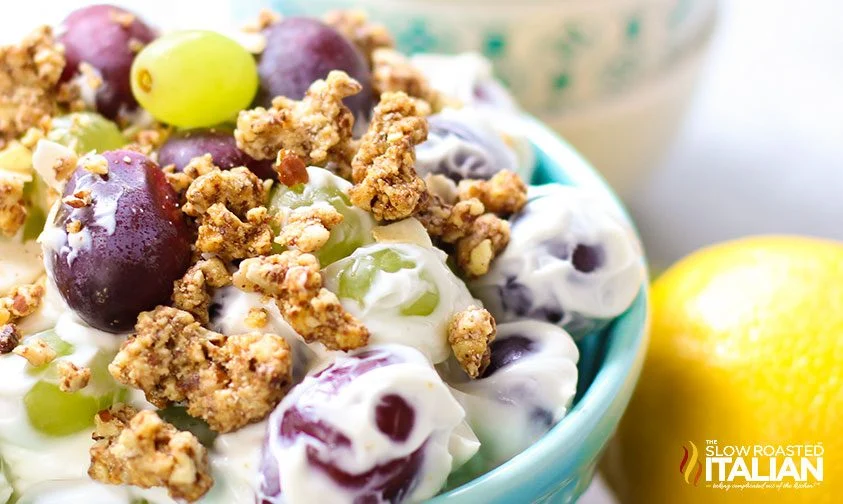 close up: grapes coated in cheesecake mixture with granola
