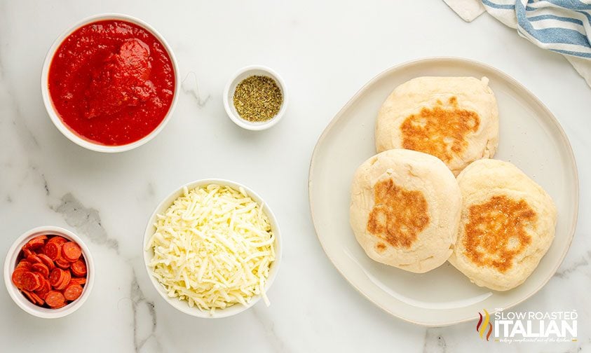 measured ingredients for english muffin pizzas