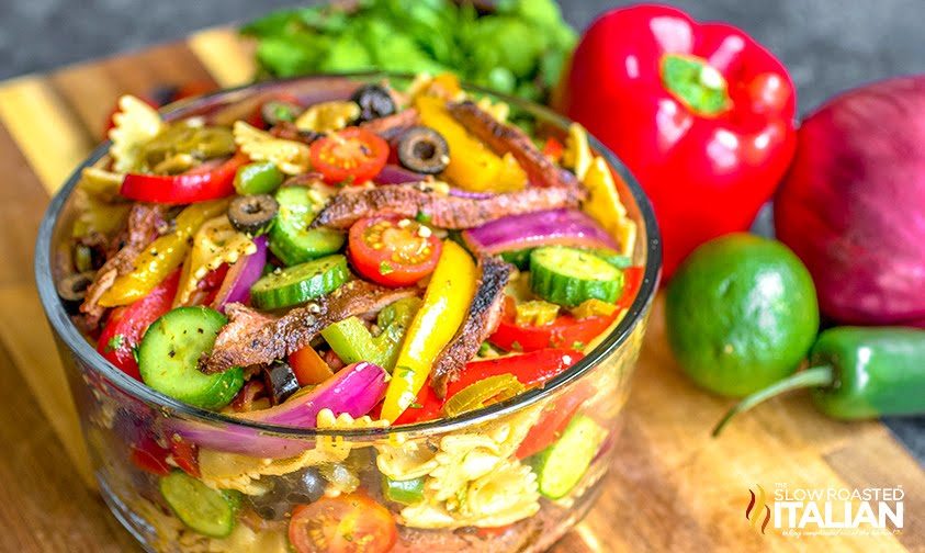 clear bowl of fajita steak pasta salad